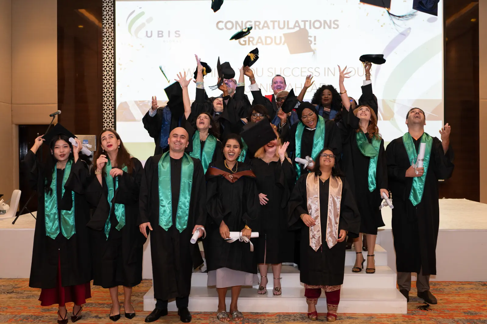 UBIS graduates celebrating at commencement