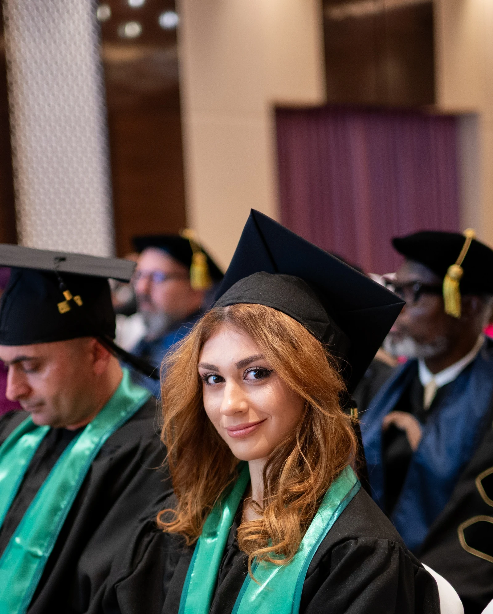 UBIS graduate looking at the camera during the graduation ceremony