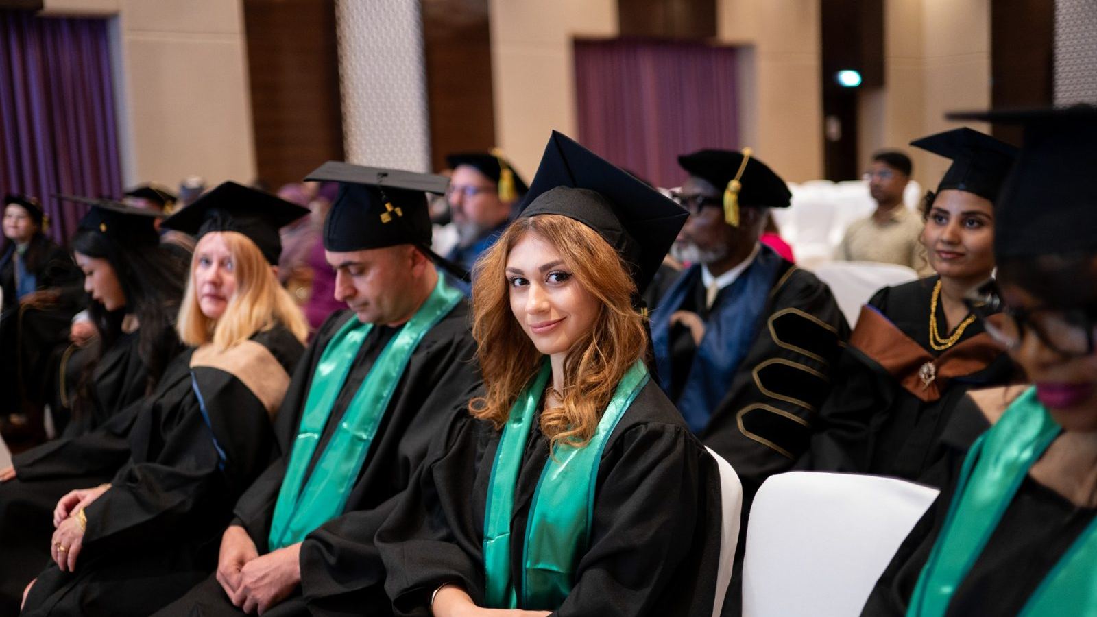 People studying together in an MBA setting, centered on the faces